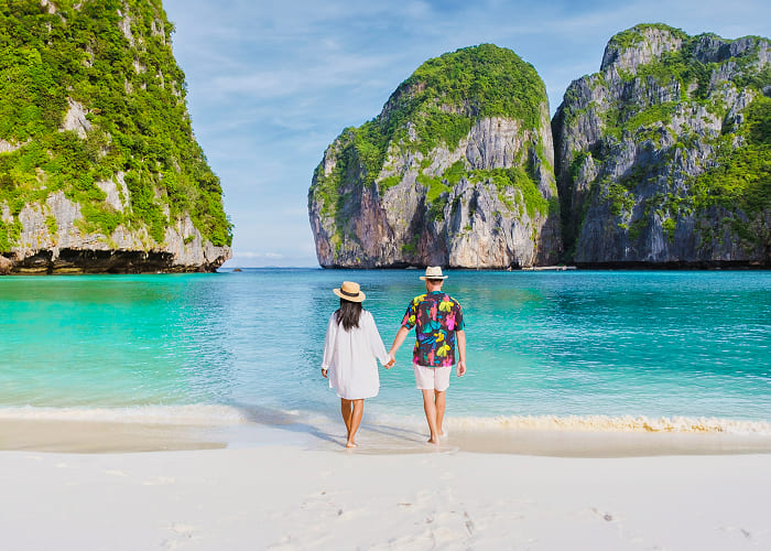 couple-in-front-of-longtail-boat-at-the-lagoon-of-2025-01-08-02-43-56-utc-1.jpg